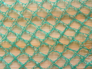 Fototapeta premium Green color net bag textured background