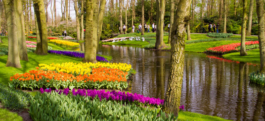 Lisse, Netherlands - 4/11/2011: People enjoying a walk through a botanical garden near Lisse.