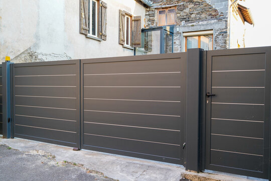 Aluminum dark brown gate of home portal of suburb house