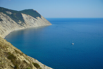 beautiful view of the sea, mountains, sky and the yacht in the bay