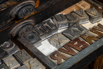 Antique metal type in a drawer in a print shop