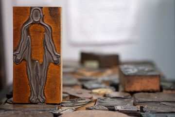 Woodcut plate of human body in a print shop