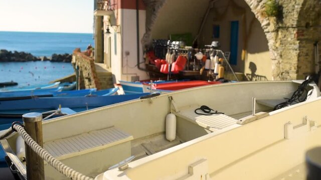 Colourful boats in tiny marina of Riomaggiore, Cinque Terre, Liguria, Italy