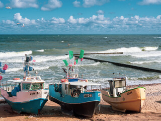 At Beach of Jaroslawiec in Poland fishing boats lie on the beach of the Baltic Sea