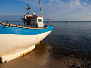 At Beach of Jaroslawiec in Poland fishing boats lie on the beach of the Baltic Sea