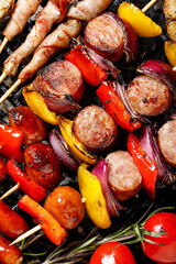 Grilled meat and vegetable skewers close up view