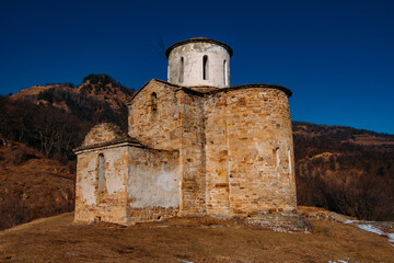 Fototapeta na wymiar Old abandoned church in North Caucasian mountains