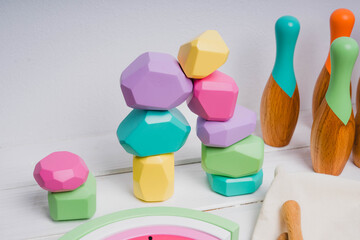 Fototapeta premium Wooden cubes with different faces for the development of coordination and balancing.