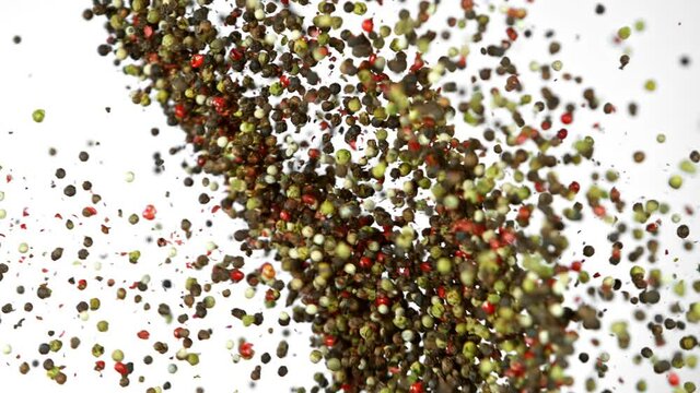Super Slow Motion Shot of Pepper Seasoning Side Collision Isolated on White Background at 1000fps.
