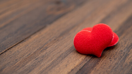 red heart shape on wood background