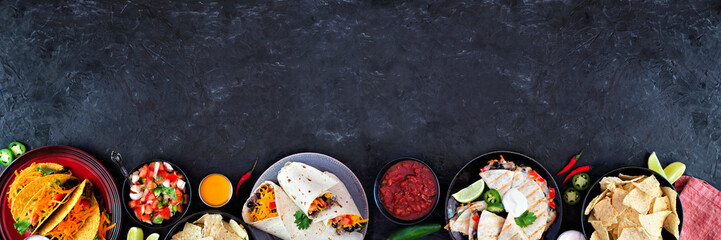 Mexican food bottom border, top view on a dark banner background. Tacos, burritos, quesadilla and nachos. Copy space.