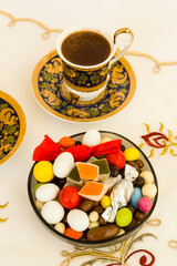 Traditional Turkish Colorful candy and delight on fabric cloth with coffee