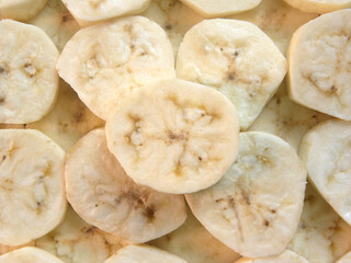 Yellow color raw sliced cut cooking plantain banana without skin