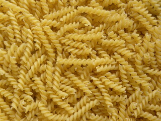 Yellow color raw Fusilli pasta