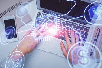 Double exposure of woman hands working on computer and data theme hologram drawing. Top View. Technology concept.