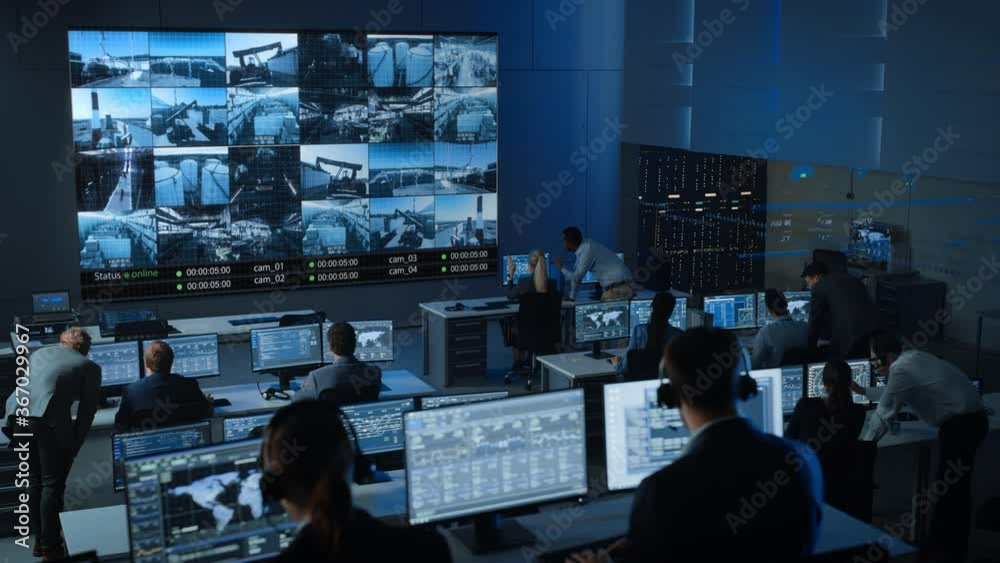Poster motion shot of a group of professionals working in a surveillance control center with cctv video foo