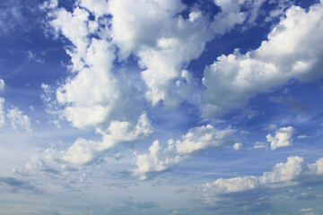 Beautiful blue sky and white large cumulus clouds. Background. Landscape.