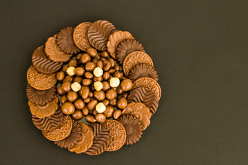 Milky and bitter round shape chocolate Madlen,designed on glass plate.The Sugar Feast or any festival celebration.