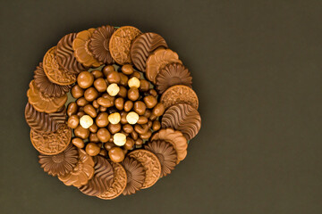 Milky and bitter round shape chocolate Madlen,designed on glass plate.The Sugar Feast or any festival celebration