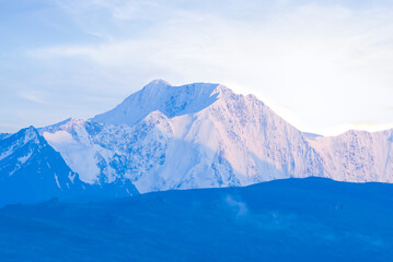 Naklejka na ściany i meble closeup mountain ridge in a snow at the early morning