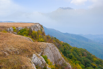 Fototapeta na wymiar autumn mountain valley landscape, forest on a mount slope