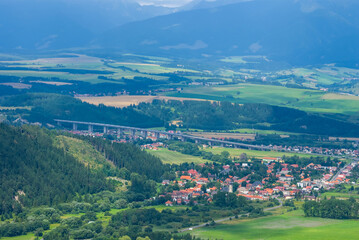 Fototapeta na wymiar view to a small european town in a green mountain valley