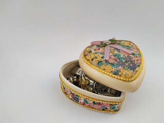precious heart shaped jewelry box with a white background