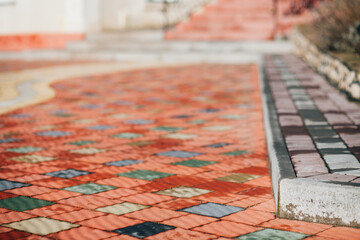 Stone pavement in perspective. Stone pavement texture. Granite cobblestoned pavement background. Abstract background of a cobblestone pavement