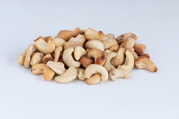 Fototapeta na wymiar roasted cashew nut pile on white background
