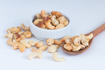 roasted cashew nuts in the bowl on white background