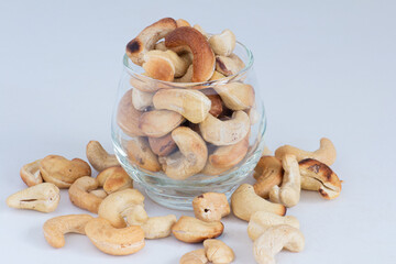 roasted cashew nuts in the bowl on white background