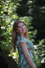 woman in green dress on nature  