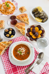 Traditional Turkish Tomato Soup with cheese and fresh mint garnised,close-up taken on Ramadan,Iftar Table.