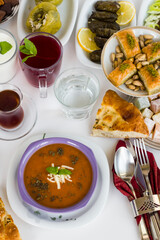 Traditional Turkish Tomato Soup with cheese and fresh mint garnised,close-up taken on Ramadan,Iftar Table.