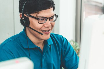 Business people wearing headset working in office to support remote customer or colleague. Call...