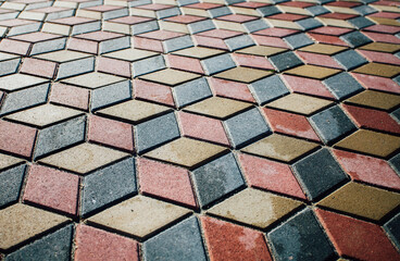 Stone pavement in perspective. Stone pavement texture. Granite cobblestoned pavement background. Abstract background of a cobblestone pavement