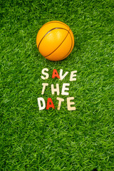 Basketball save the date on green grass background