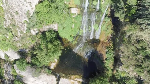 Waterfall in rocky mountain. Aerial Video