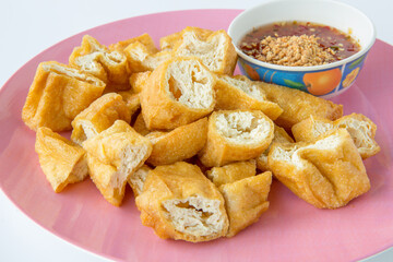 Top view of fried Tofu on a white background