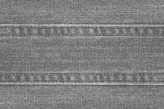 Gray Denim or jeans fabric with seam texture abstract background