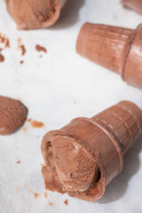 Coffee ice cream on white background, with sunlight melting ice cream