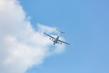 Turboprop aircraft flying through the sky at low altitude