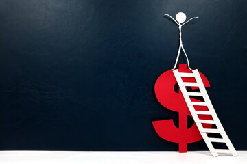 Human stick figure on top of a red dollar sign cutout with ladder. Financial success concept. 