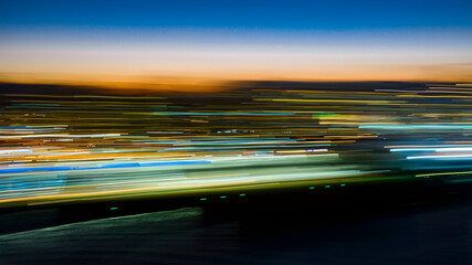 Motion blur: sunset in a river city