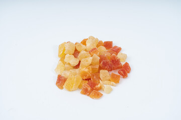 Mix of various dried fruit(orange,  apricots, cranberries) on white background.