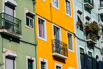 View of classic facade of ancient historical buildings in the downtown area of Lisbon, the hilly coastal capital city of Portugal and one of the oldest cities in Europe