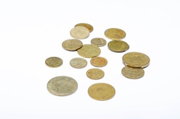 Ukrainian coins on a white background in close-up. Coins in a heap close-up, in the form of a falling pyramid, in a man's hand
