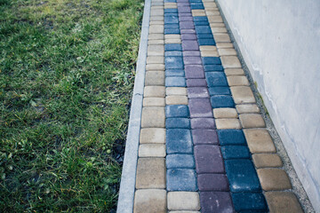 Perspective View Monotone Gray Brick Stone Pavement on The Ground for Street Road. Sidewalk, Driveway, Pavers, green grass