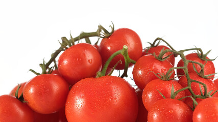 fresh ripe tomatoes and cherry tomatoes on white background close up