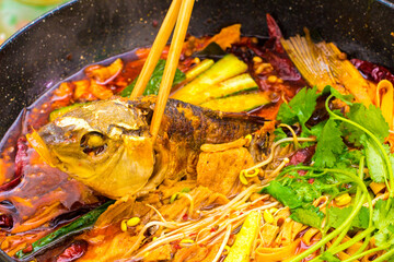 Grilled fish in spicy red oil